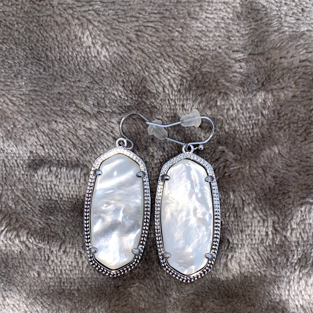 White iridescent Kendra Scott drop earrings